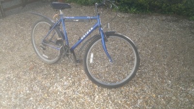 mountain bike plus spare wheels and handlebars