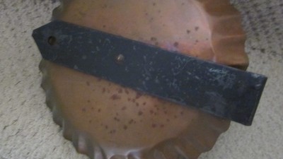 Antique copper and iron wall candle sconce. Crimped around outside.