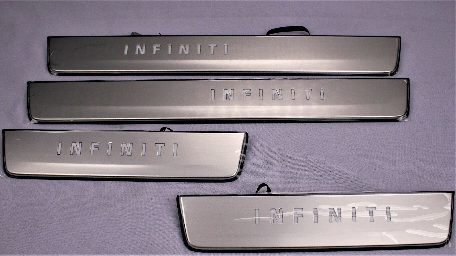 NEW OEM INFINITI QX80 RADIANT ILLUMINATED DOOR SILL KICK PLATES 999G6