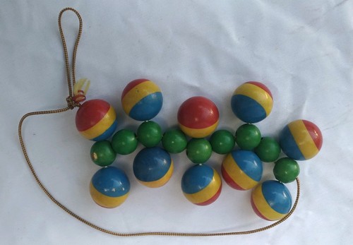 Vintage Wooden Rolling Pull Toy Primary Colors Jointed Roller Toy