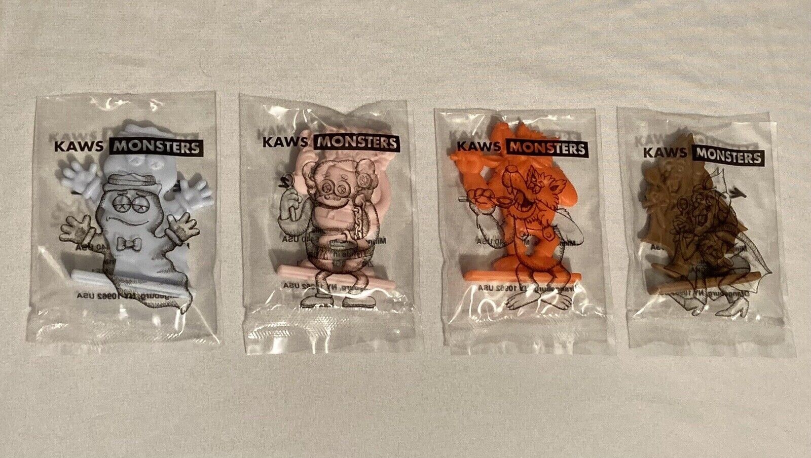 KAWS Monsters Lot Of 4 Figures KAWS 22 Limited Edition KAWS Monsters Lot Of 4 Figures KAWS 22 Limited Edition