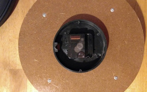 One Large Brown/Glass Round  Wall Clock. Works Great. Quartz