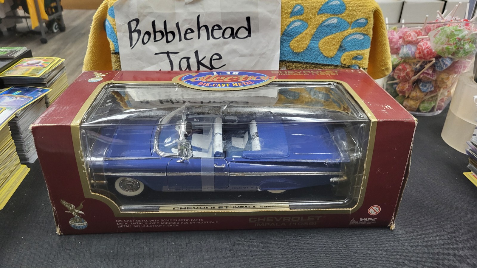 NIB 1959 CHEVROLET IMPALA CONVERTIBLE BLUE 1/18 DIECAST ROAD