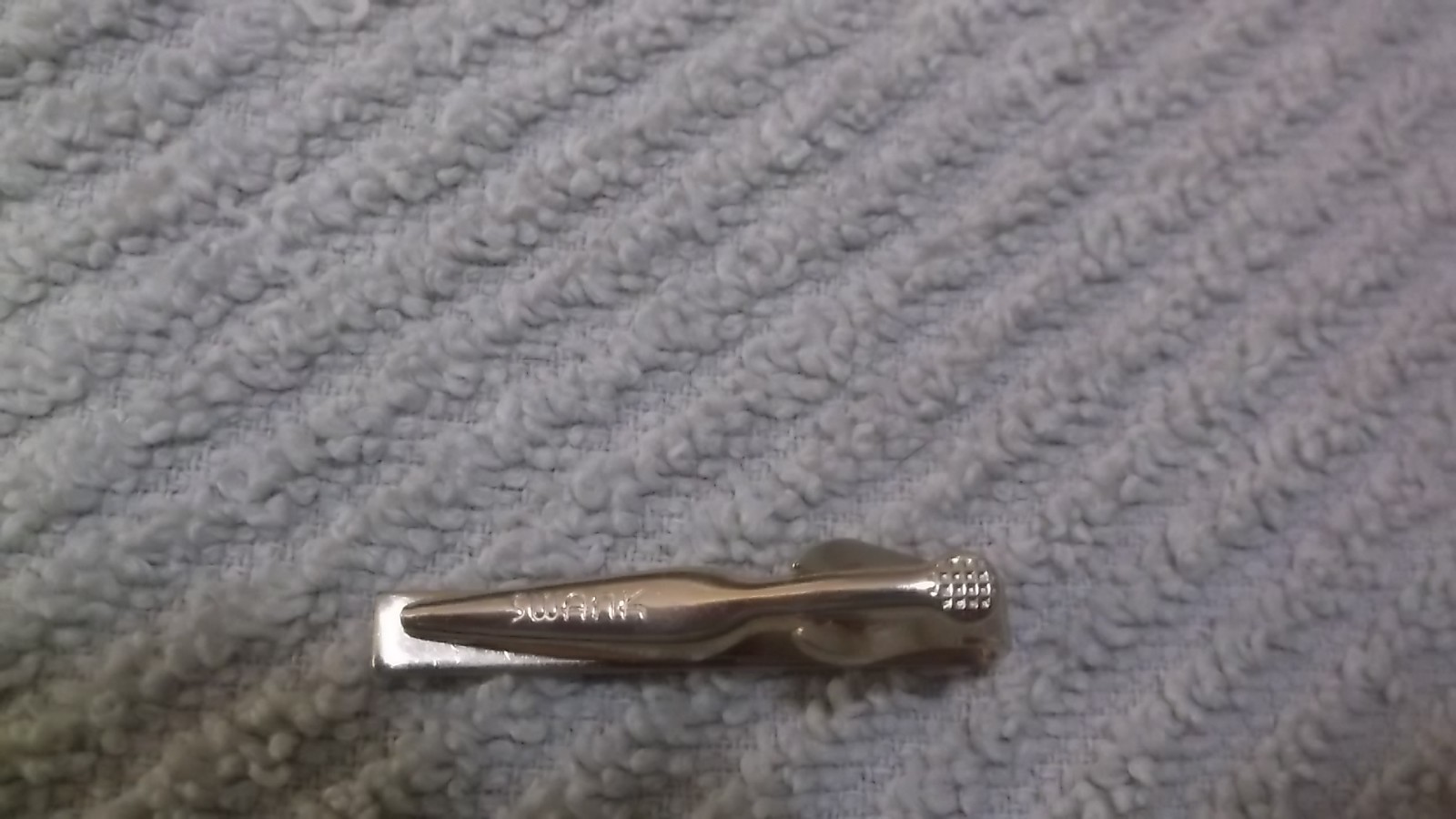 Vintage Swank Signed Textured Goldtone Tie Clip With An Etched Star