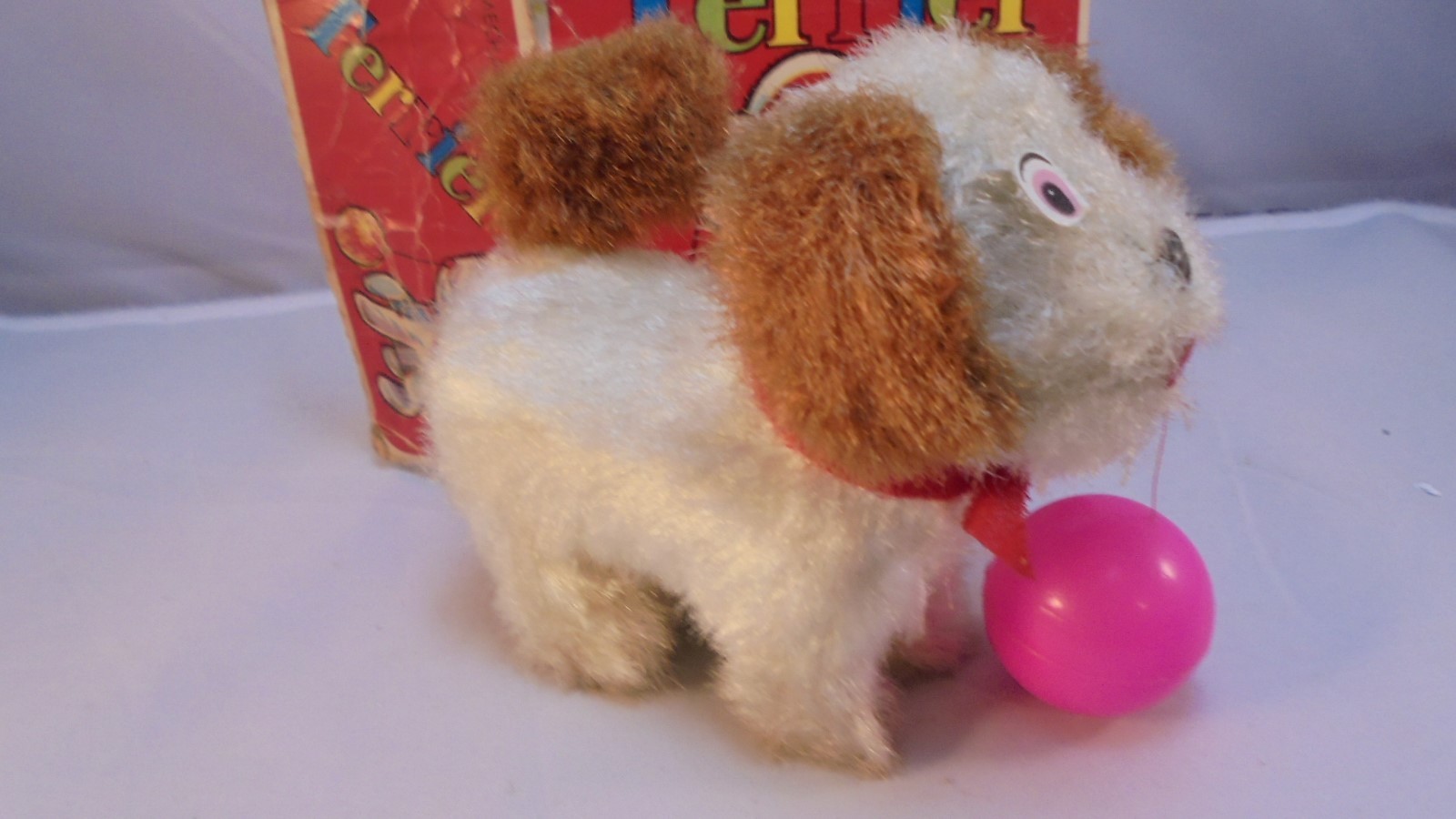 Vintage Mechanical Terrier Wind-up toy dog with spinning tail with original box