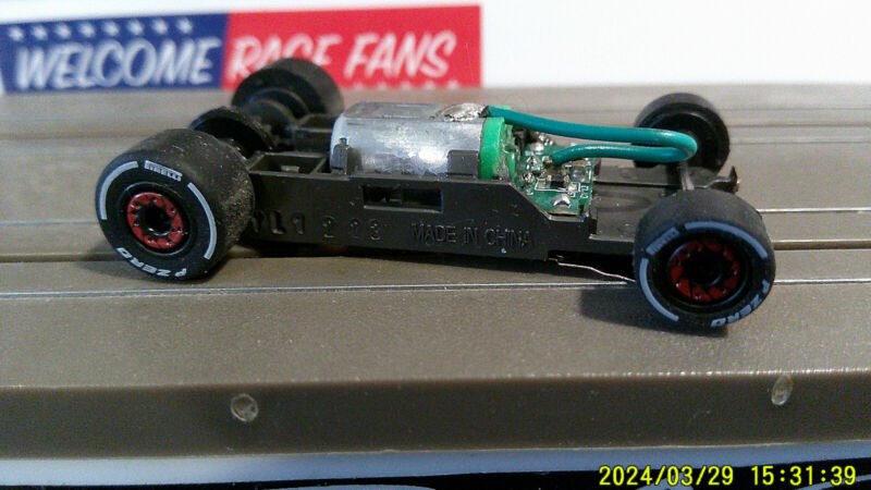 AFX RACING H.O. SCALE MEGA G+ 1.7 NARROW CHASSIS WITH F-ZERO ALPHA ROMEO TIRES