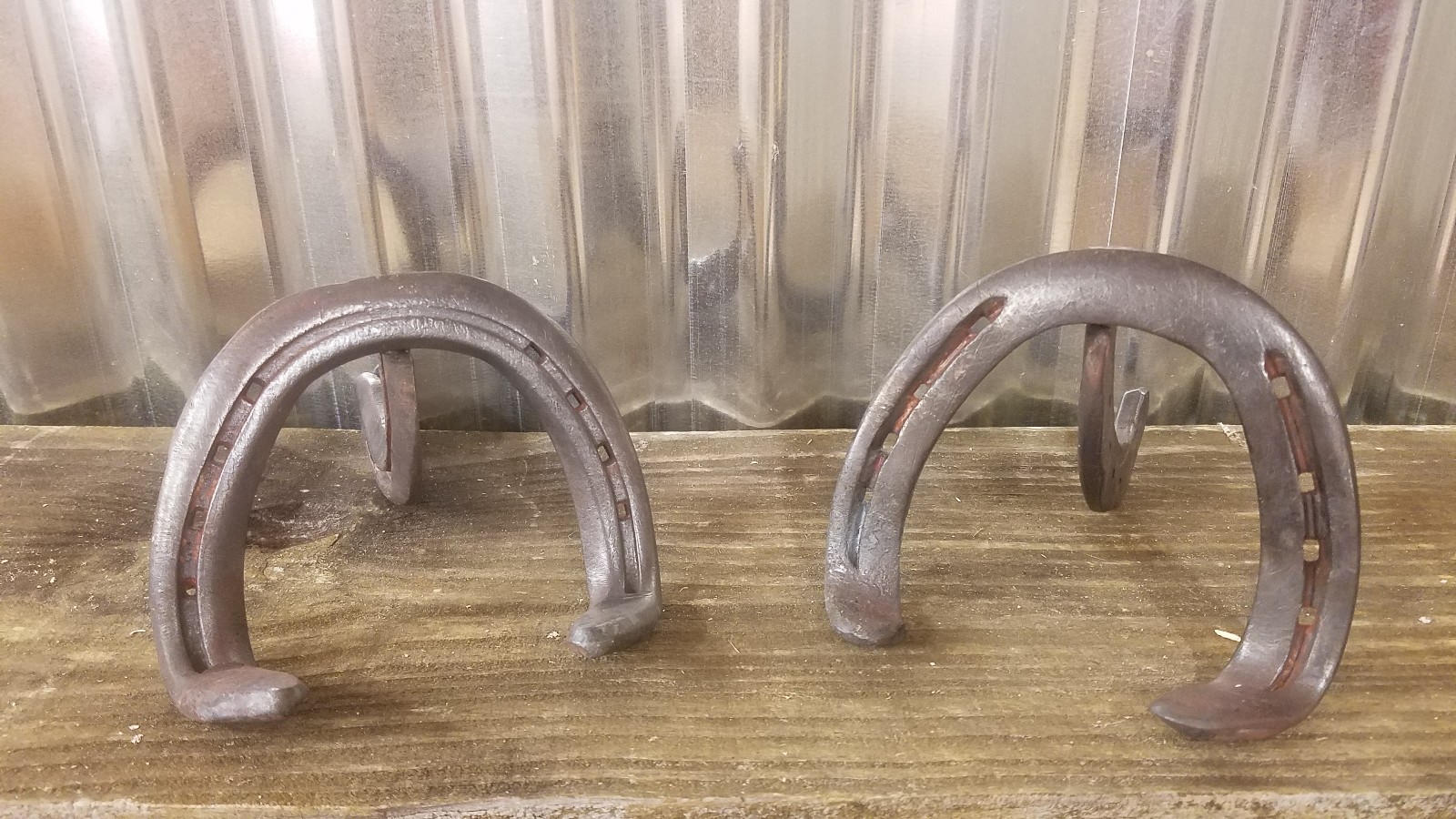 Mr. and Mrs. sign with hand forged horseshoe sign holders