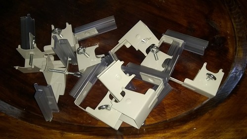 Under shelf spring mount super grip sign holder