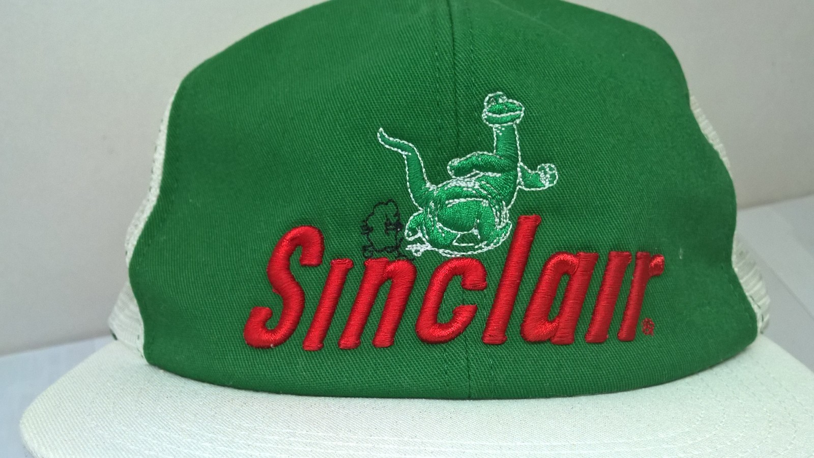 Sinclair with running dinosaur Hat Cap snapback mesh embroidered made in USA