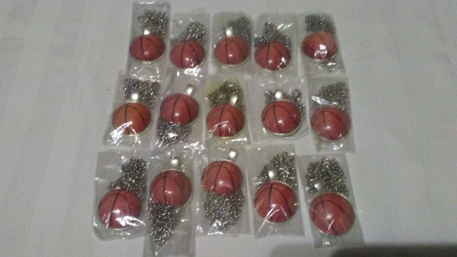 Lot of 15 Basketball Necklaces. 75% off.