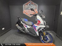 2023 BMW C400 X in red white and blue with only 1422 miles.