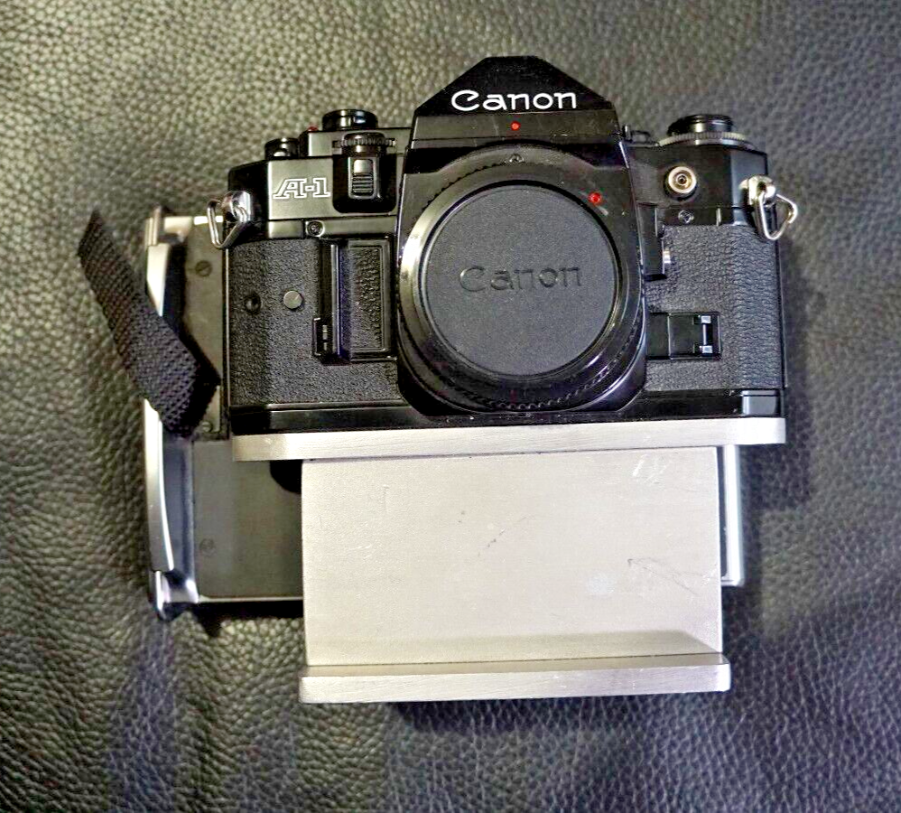 CANON A1 35MM FILM CAMERA WITH POLAROID FILM BACK CANON A1 35MM FILM CAMERA WITH POLAROID FILM BACK