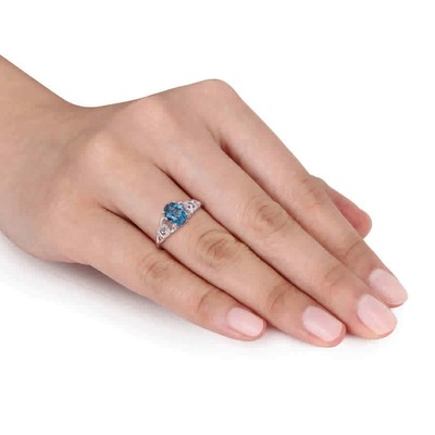 Pre-owned Amour 1 5/8 Ct Tgw Oval London Blue Topaz And Diamond Accent Link Ring In 10k In White