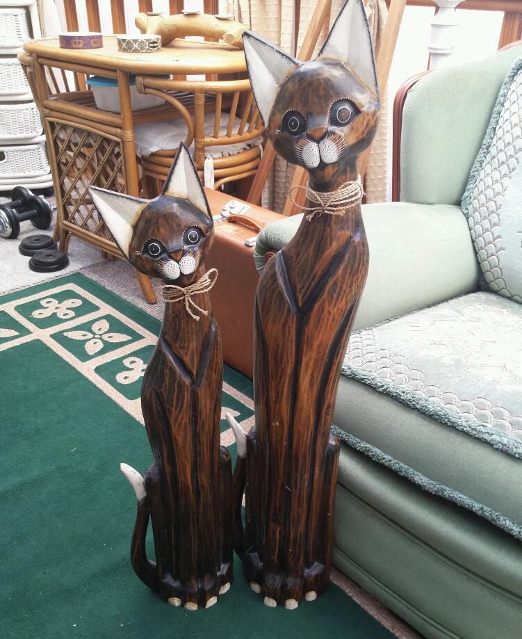 2 very large wooden cat carved figures in Willerby, East Yorkshire
