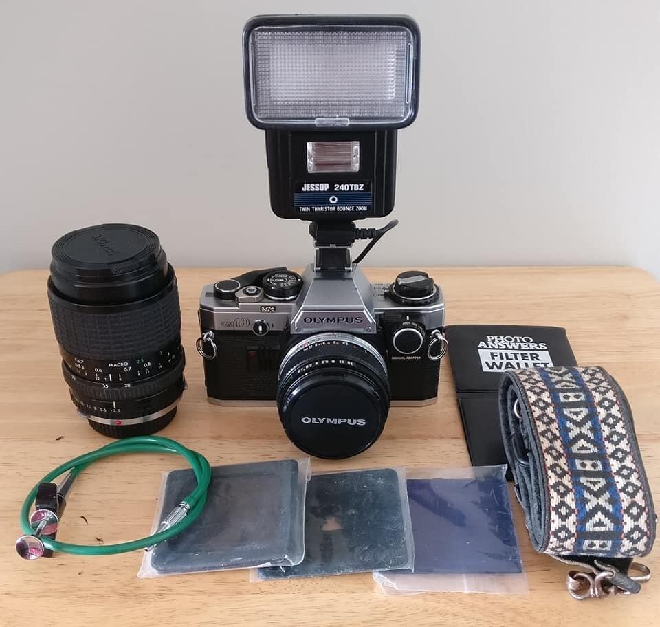 OLYMPUS OM10 SLR FILM CAMERA WITH MANUAL ADAPTER, 2 LENSES, FLASH GUN