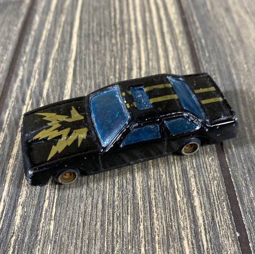 Vintage Black Gold Car with Blue Windows Toy Vehicle for