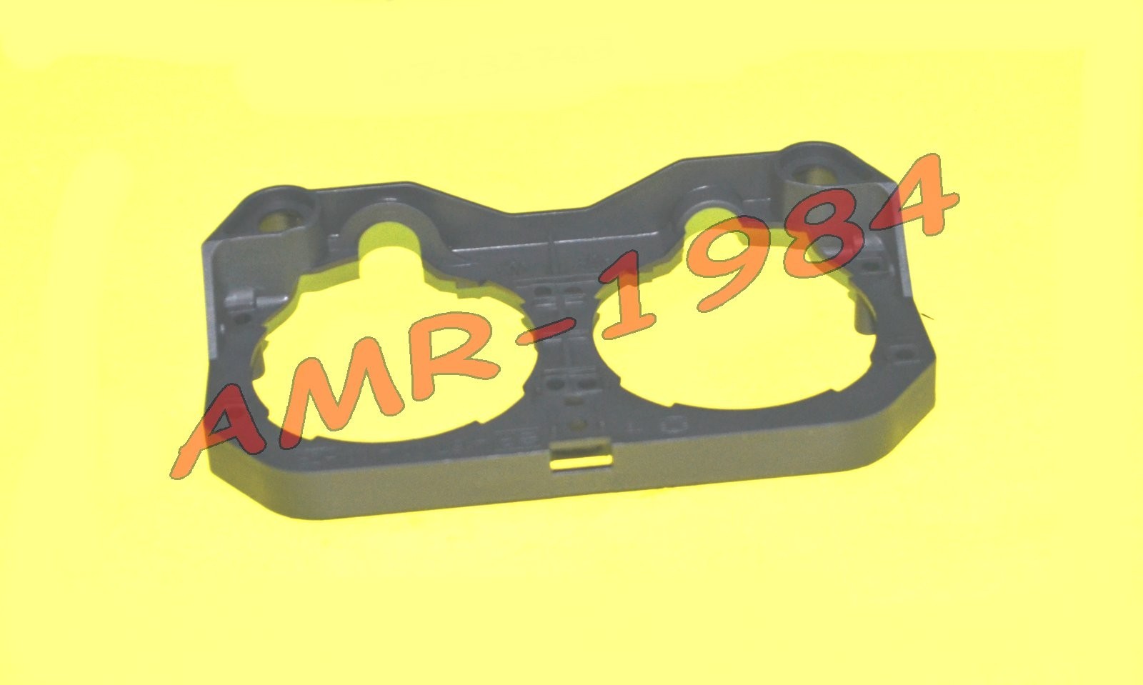 SUPPORTO GRUPPO FARI IN PLASTICA F12 100 DAL 1999 AL 2000