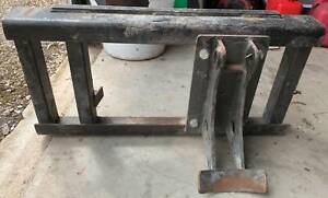 Frame with auger cradle for mini loader