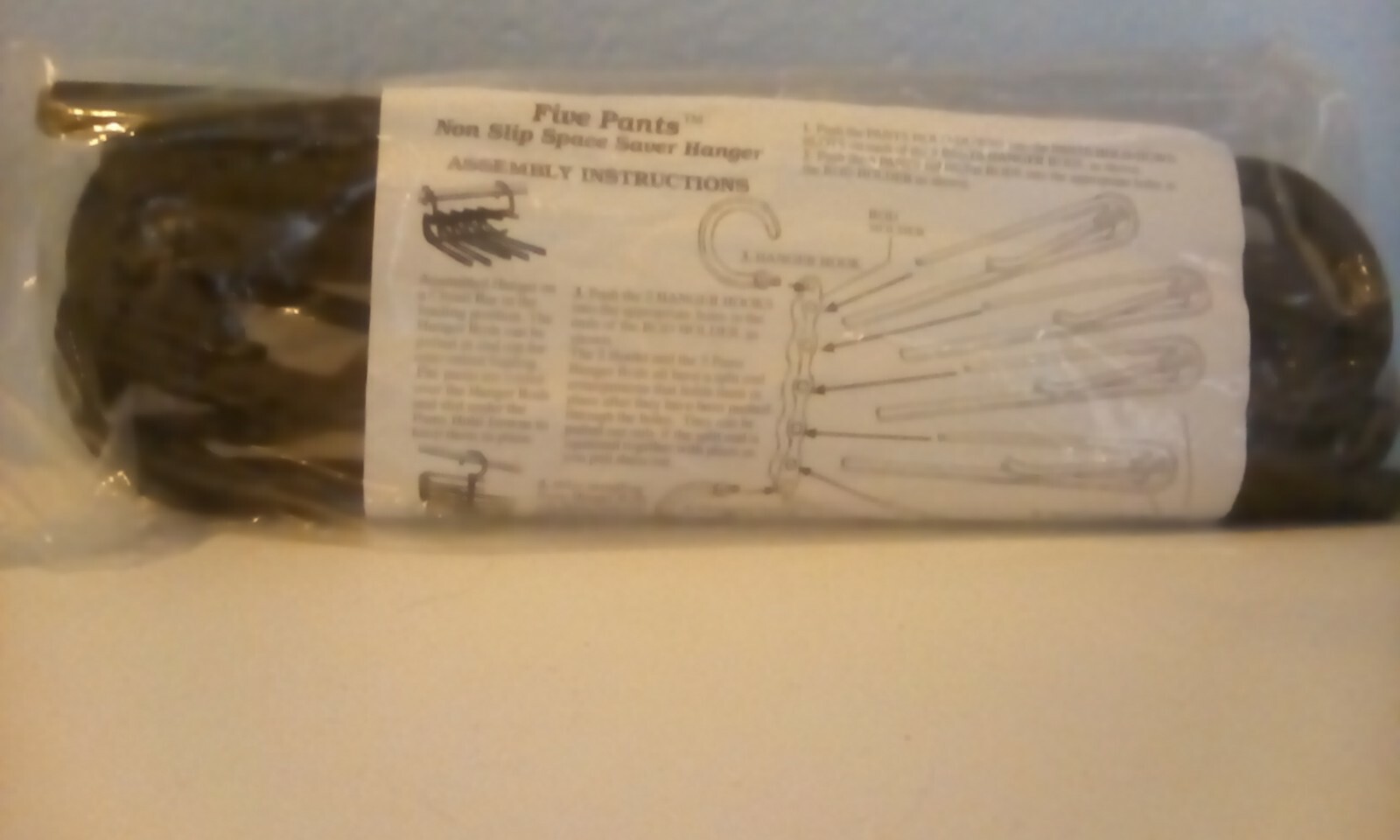 3 Space saver hangers. 5 pairs of pants or other garments.