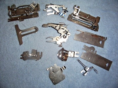 LOT OF 25-30 VINTAGE METAL SEWING MACHINE ATTACHMENTS WITH ORIGINAL BOXES