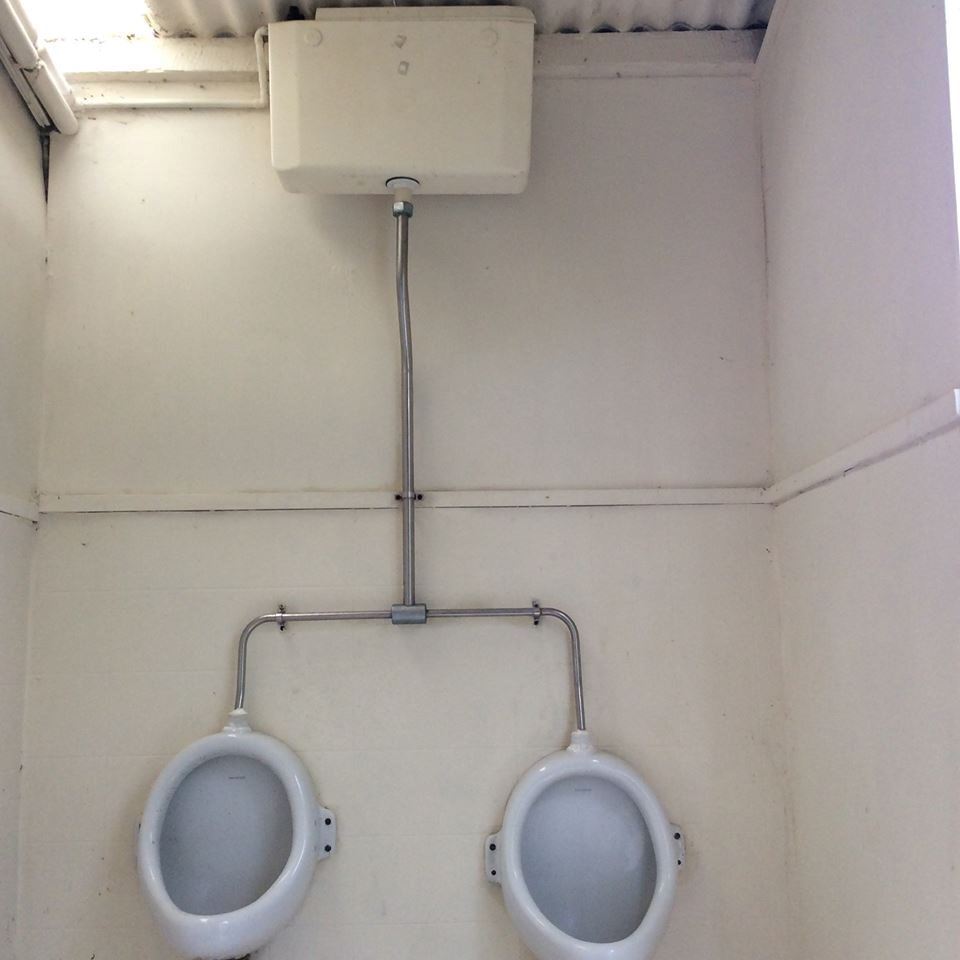 2 x Twyford Urinals complete with chrome pipe and auto flushing cistern