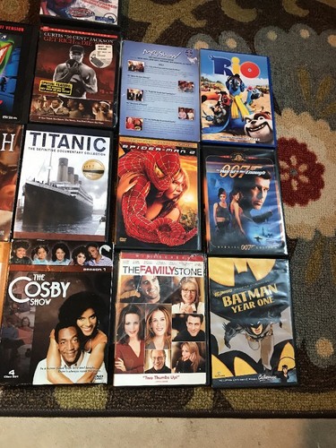 Wholesale lot of 16 DVD's: Drama Action Comedy Movies Cartoons Spider-Man
