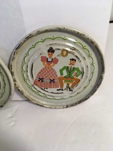 VINTAGE METAL COASTERS SET OF FOUR WOMAN IN HOOP DRESS MAN WITH Moustache CREAM