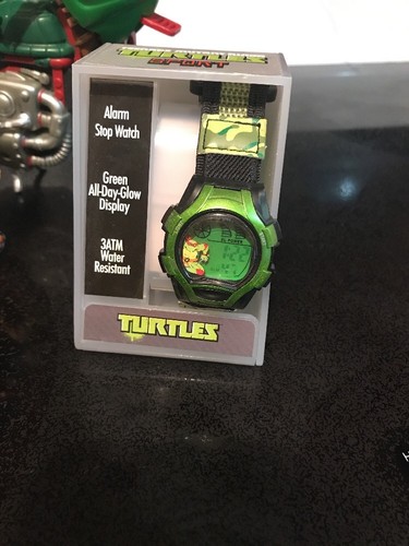 Lot Of Teen Age Mutant Ninja Turtle Action Figures And Watch