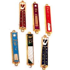 A Set of 6 Gold Plated Mezuzahs with Different enameled Themes. About 3 Inches.