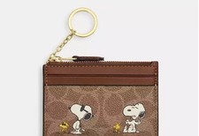 Coach X Peanuts Mini Skinny ID Card Case In Signature Canvas With Snoopy Print