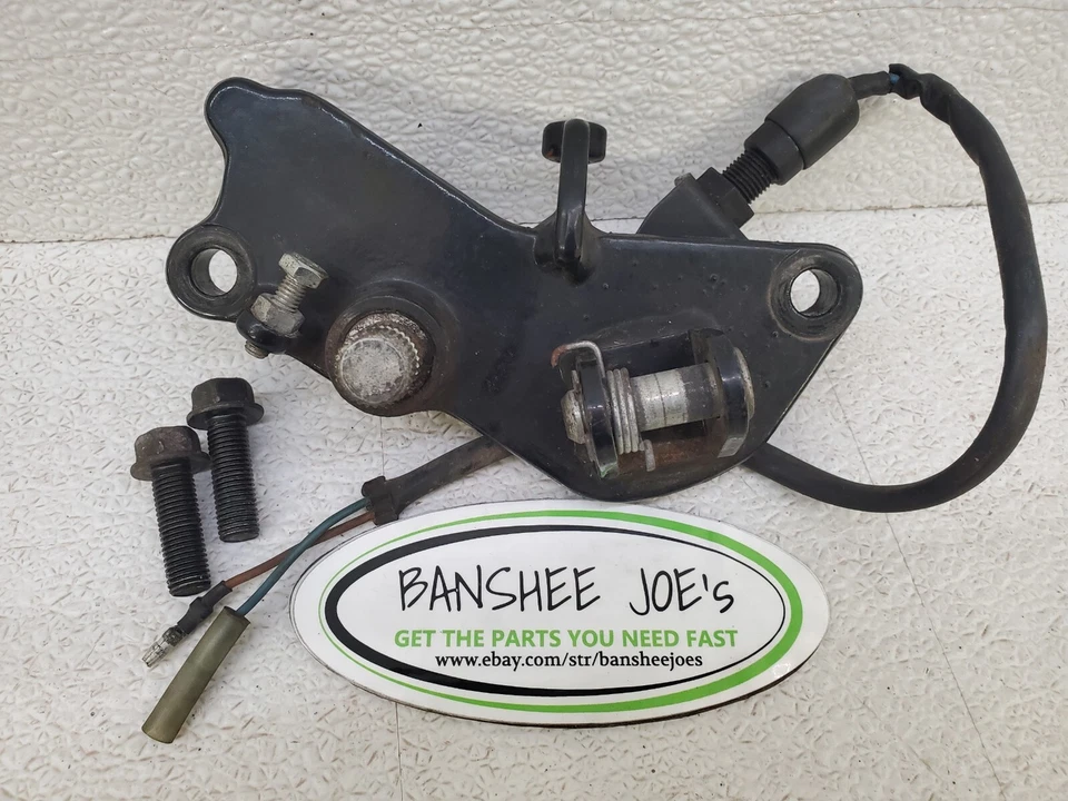 86-06 Kawasaki Vulcan 750 reposapiés derecho soporte eje freno interruptor OEM Foto 3 de 3