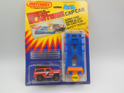 Seltene Matchbox Mega-Blasters! MC-4 Blazer Trail Tracker Orange 4x4 Cap Auto Neuwertig