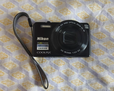 Nikon COOLPIX S7000 Digital Camera 16 MP 20x Optical Zoom English
