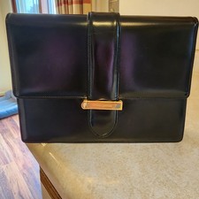 Valentino Garavani Vain clutch bag in black shiny calfskin leather