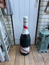 Large advertising bottle of champagne