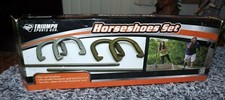 TRIUMPH SPORTS HORSESHOE SET, NEW OLD STOCK. 2012 W/ BOX. 4 CAST SHOES, 2 STAKES