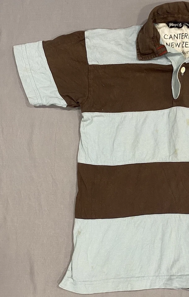 Polo de Rugby Canterbury of New Zealand Niños M Azul Marrón Rayas Jugado en el Cielo Foto 3 de 4