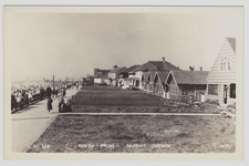 Postcard RPPC Seaside Oregon Promenade People Beach Cars Houses Bicycle Rental