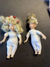 Artist Signed Porcelain Girl Dolls numbered 5" tall in undergarment