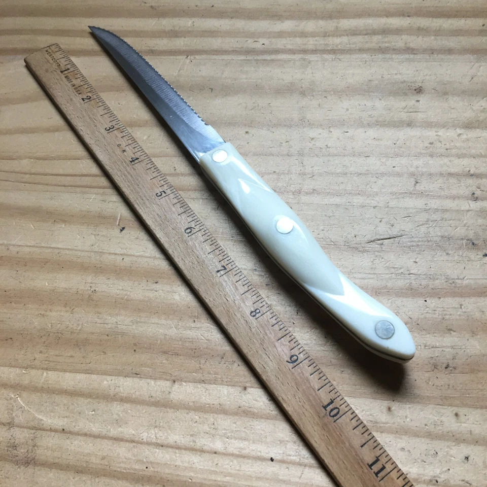 Cuchillo para carne de diente de sierra de acero inoxidable mango blanco perla CUTCO 1721 JF EE. UU. 10" L Foto 2 de 4