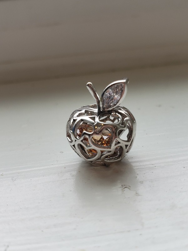 Sterling Silver Apple Pendant With Enclosed Eye-Catching Ornament