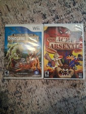 Lot Of 2 Wii Games Dinosaur Strike Looney Tunes Acme Arsenal Tested