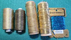 GOLD Lot 2 spools Madeira supertwist metallic thread & 2 unmarked, 1 elastic + — photo 1