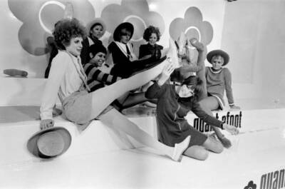 Mary Quant pictured in black, sitting down at the front, holding t- Old Photo