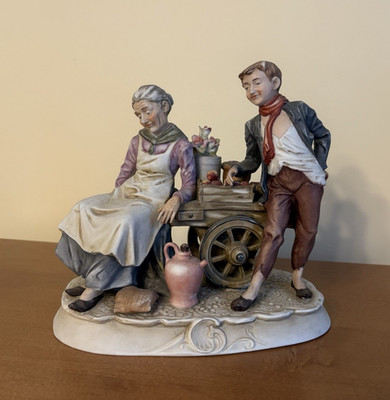 Vintage Capodimonte Figure-Old Woman And A Sharp Man Leaning On Vendor Cart