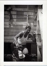 WW2 Photo of Soldier Painting Wood Barracks