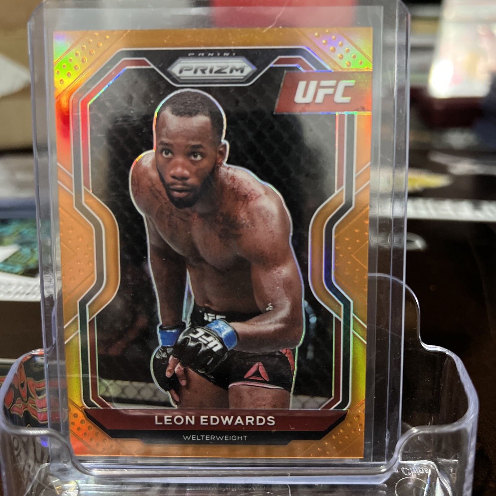 2021 Panini Prizm UFC Prizms Orange #17 Leon Edwards /99 The Welterweight CHAMP