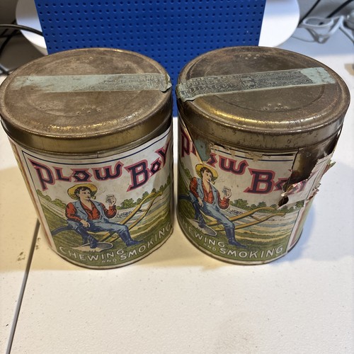 Pair of Rare 1920s paper label “Plow Boy" 14oz humidor tobacco tin. 