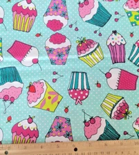  Festive Fun and Colorful Cupcakes with Toppings on Dotted Aqua Fabric 