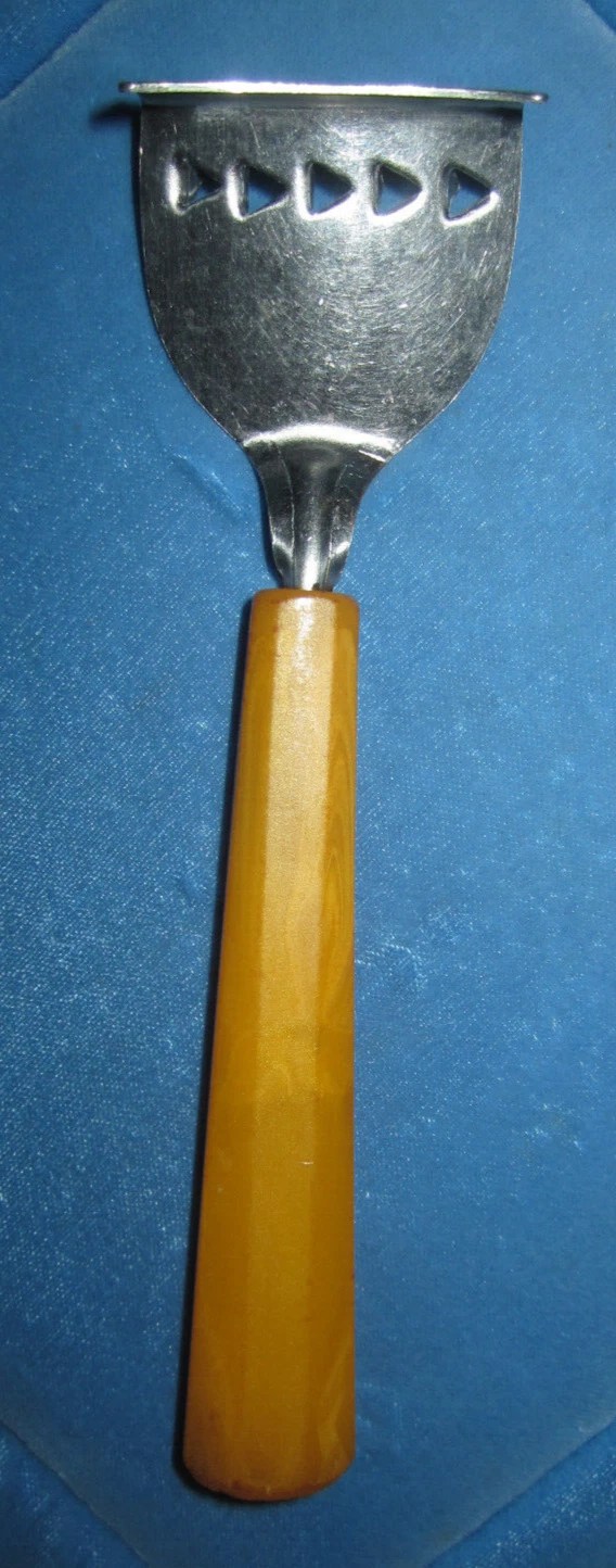 Vtg butterscotch Bakelite handled citrus zester bar tool
Opens in a new window or tab